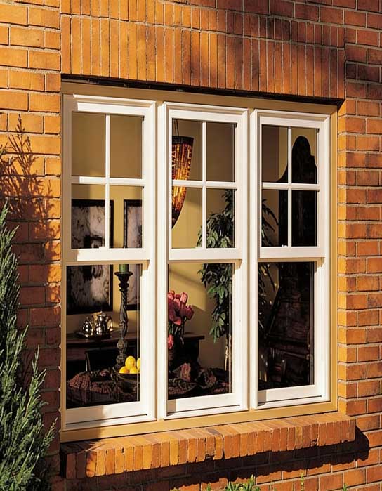 Brick exterior home featuring white-framed Double Hung Windows Atlanta with traditional grid panes, highlighting classic architectural style, smooth sash operation, and elegant residential window design.